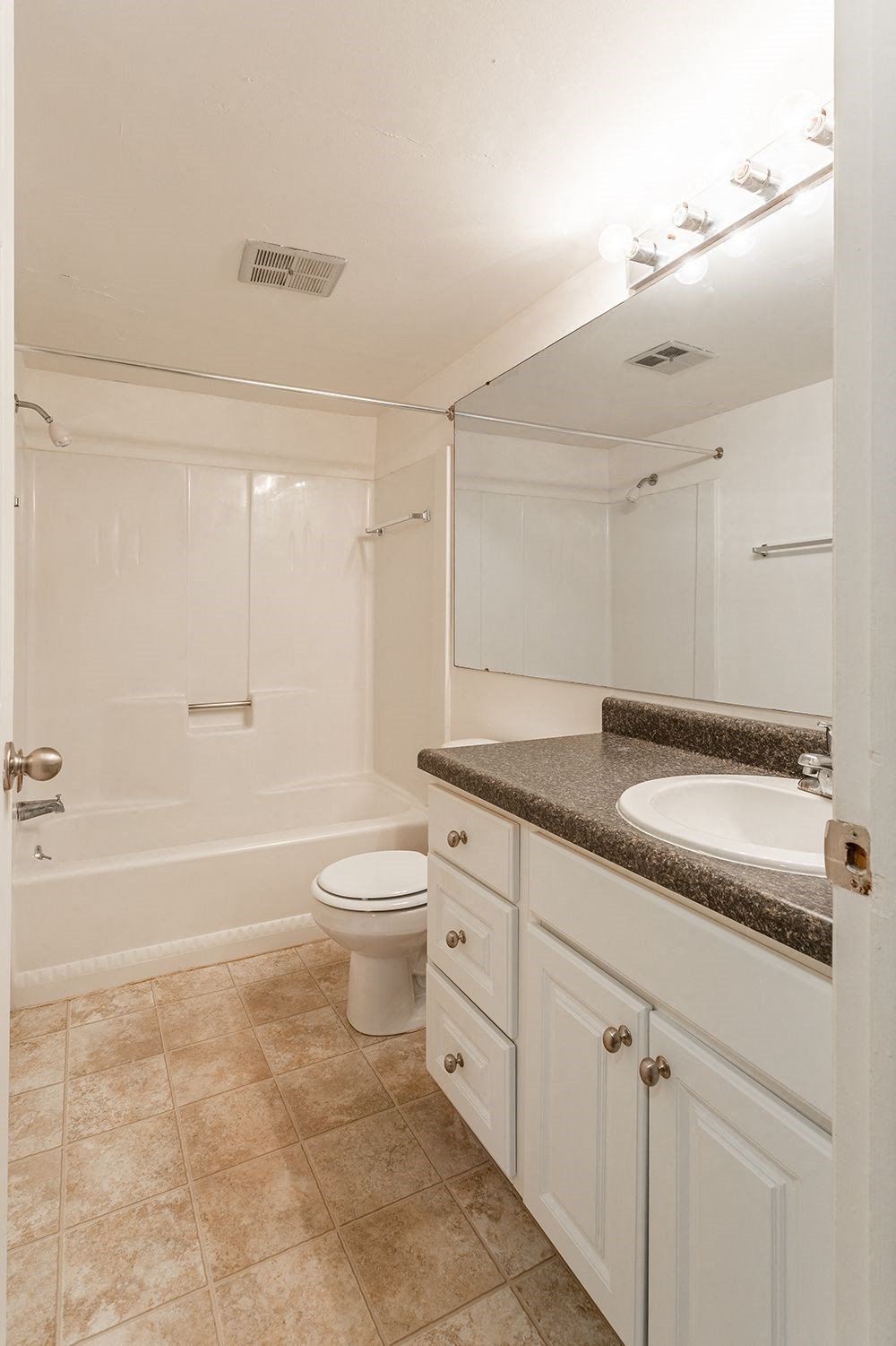 a bathroom with a sink toilet and a shower