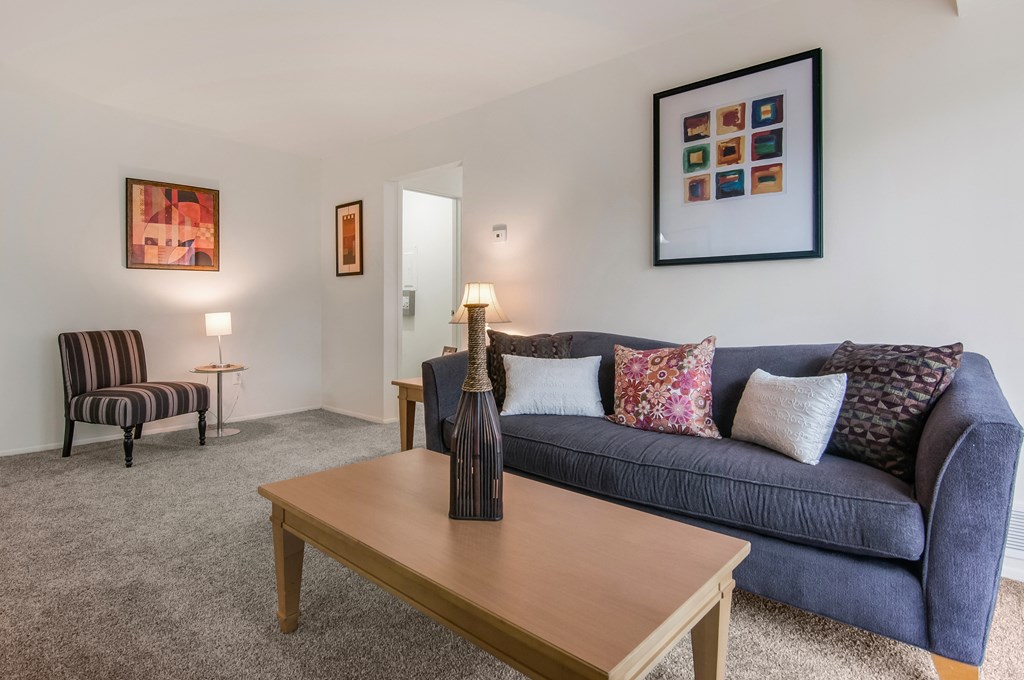 a living room with a couch and a coffee table