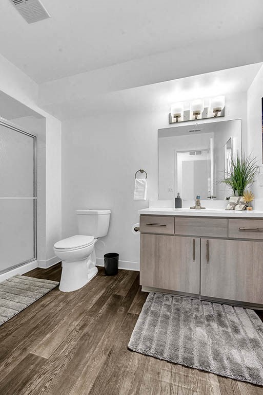 a bathroom with a toilet and a sink and a mirror at Edge At Farmington Hills - Farmington Hills, MI, Farmington Hills, MI, 48334