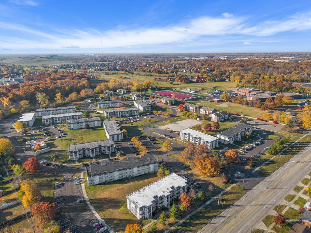 an aerial view of a college campus with buildings and trees