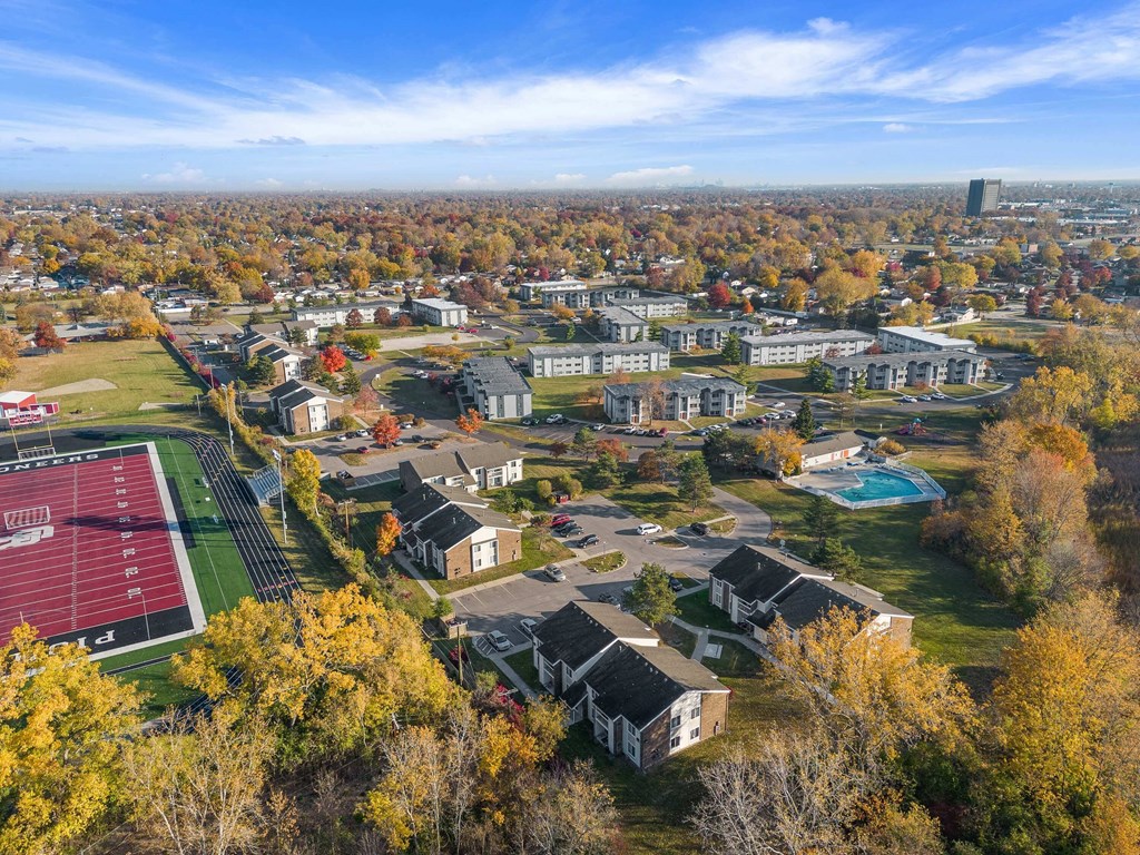 an aerial view of a neighborhood with houses and trees