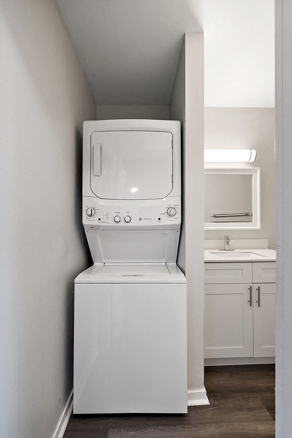 an empty laundry room with a washer and dryer