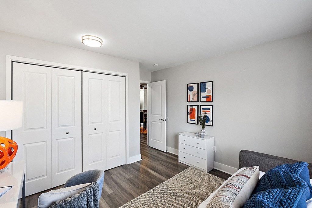 a living room with white closets and a couch
