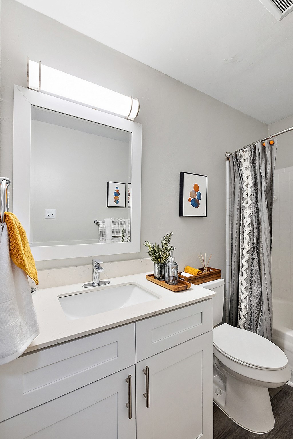 a bathroom with a sink toilet and a mirror