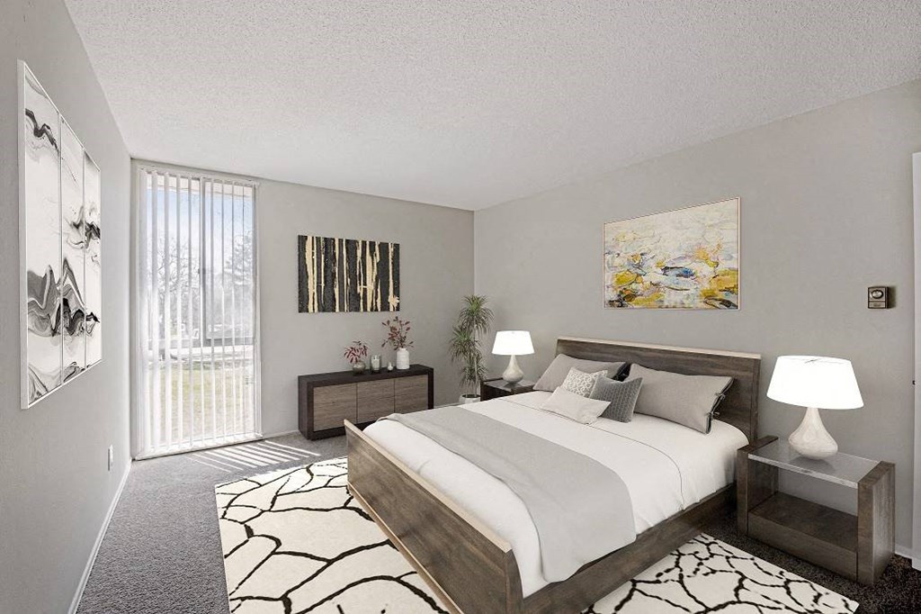 A bedroom with a large bed and a painting on the wall at The Waverly on the Lake - Belleville, MI Apartment , Belleville, 95050