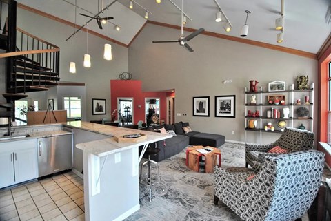 A kitchen with a dining table and chairs.