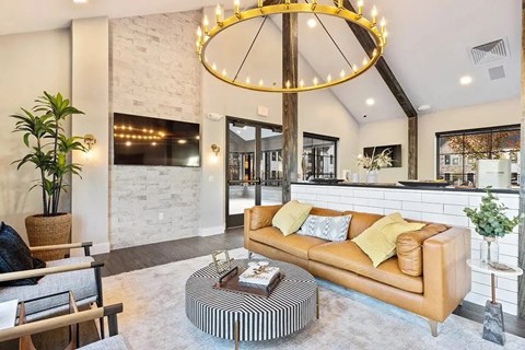 A living room with a leather sofa and a coffee table.