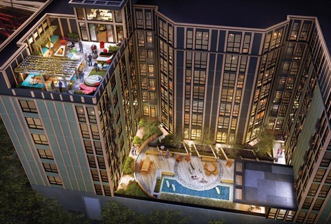 A high rise building with a pool and a garden on the roof.