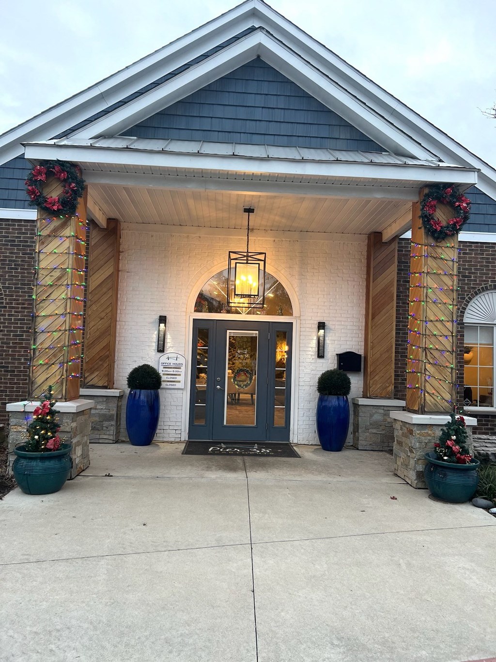 the front entrance of a building with a blue door