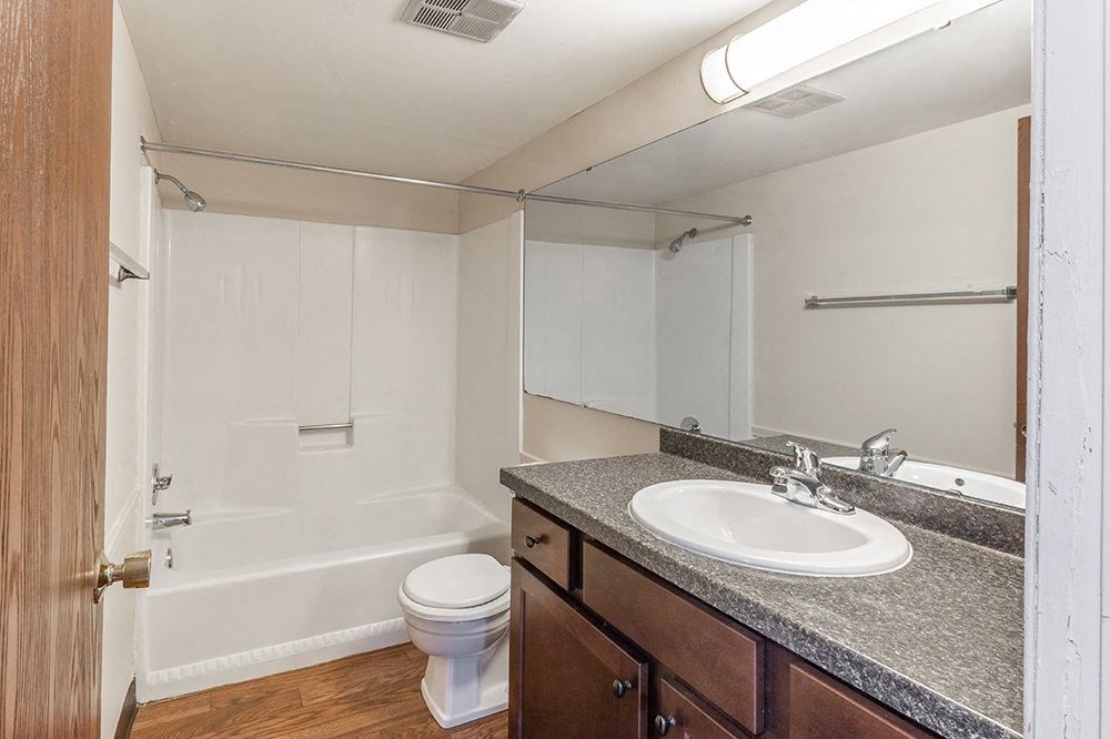 a bathroom with a sink toilet and a shower