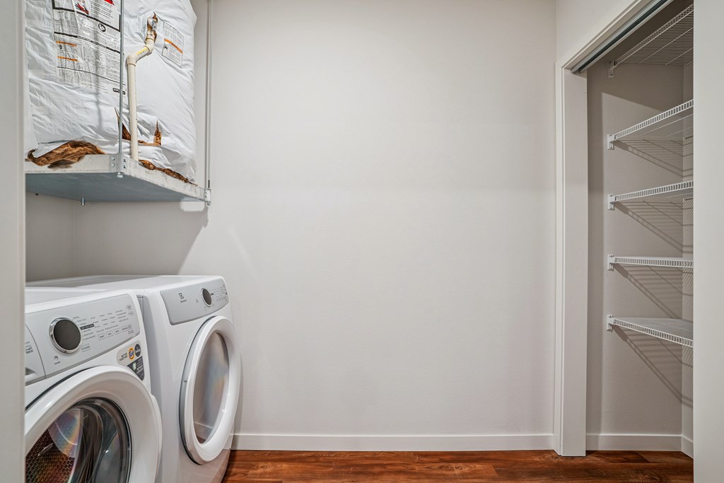 A laundry room with a washer and dryer.