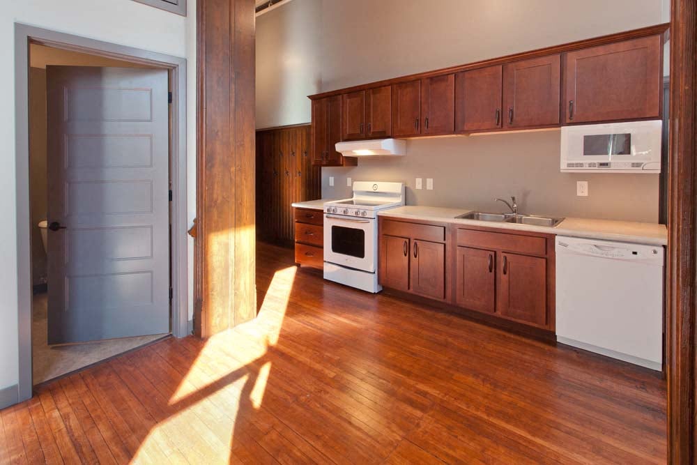 Kitchens in Roosevelt School feature microwave, diswasher, range, and refrigerator.
