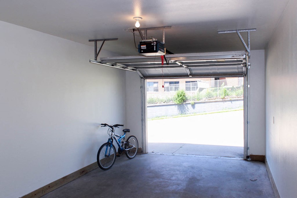 A bicycle is parked in a garage.