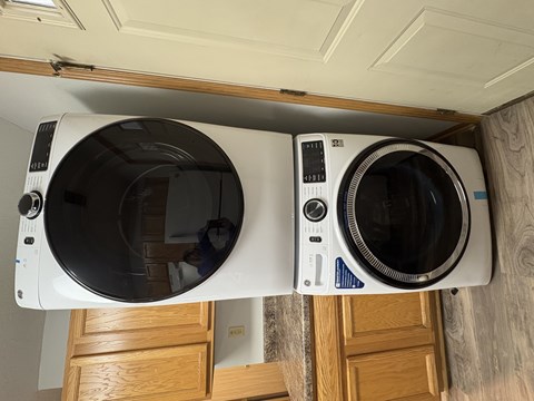 Two white ovens are installed in a kitchen.