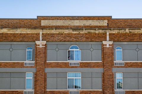 A brick building with the words "Lessonich Building" on the top.