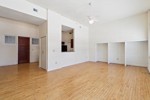 A room with wooden floors and white walls.