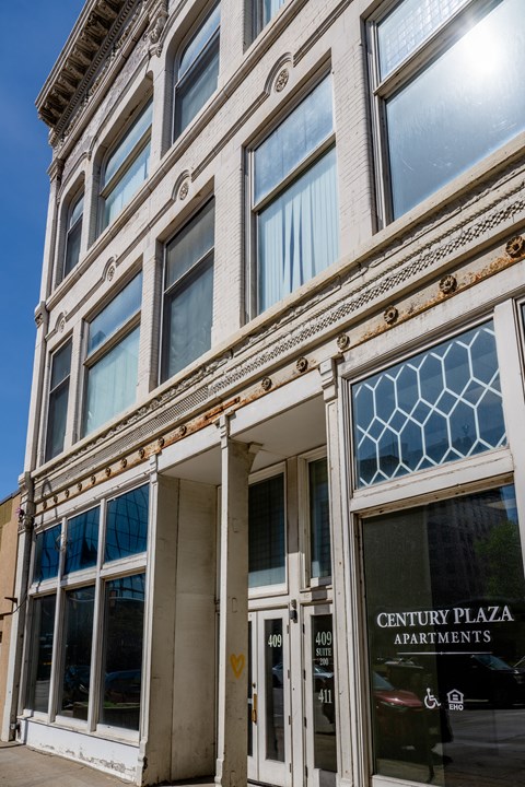 Century Plaza Apartments building with a blue sky in the background.