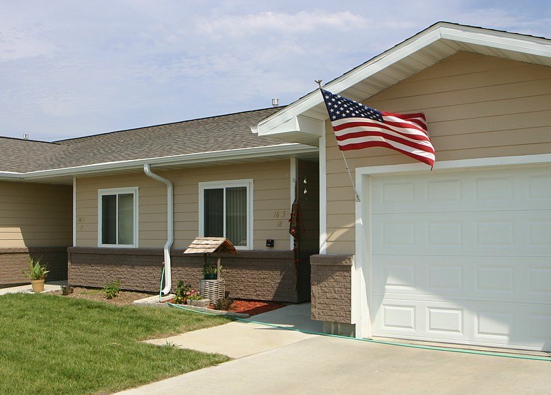 A house with a flag on the roof.