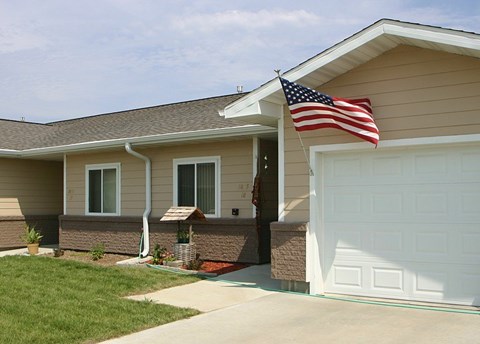A house with a flag on the roof.