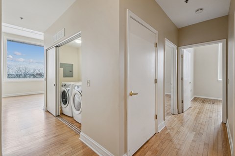 A laundry room with a washer and dryer in it.