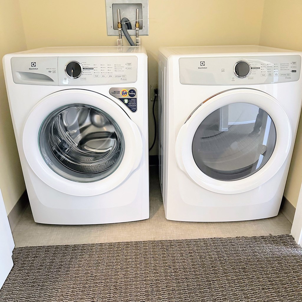 a washer and dryer in a room next to a washing machine