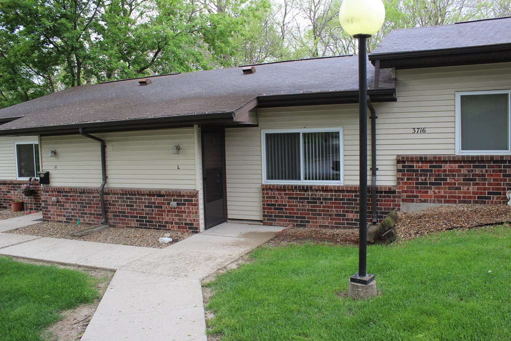 a house with a lamp post in front of it