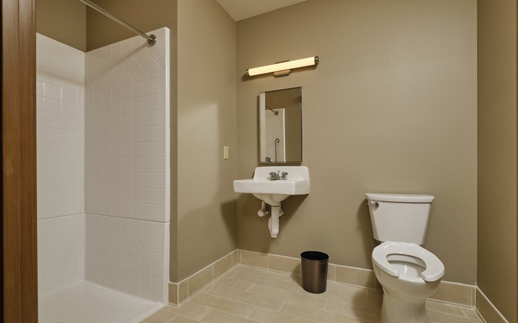 a bathroom with a toilet sink and bathtub