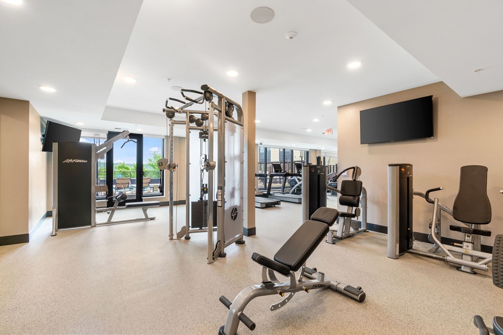 The resort-style luxury 24-hour fitness center at Lilia in Lilydale, MN 55118, with cardio equipment, free weights, and exercise machines.