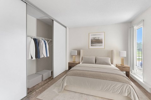 A bedroom with a large bed and a wardrobe.