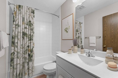 Bathroom in a renovated apartment home at Oakwood Apartments in Plymouth, MN  55447