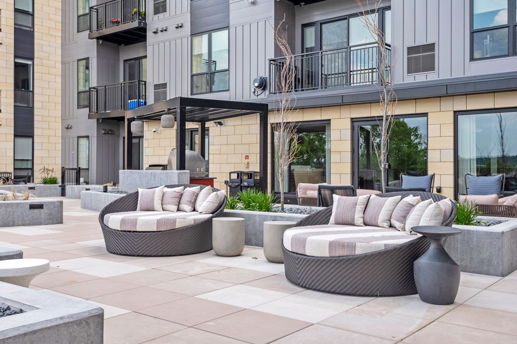 Zen Terrace with Lounge Chairs and Grills at Lilia Apartments in Lilydale, MN 55118