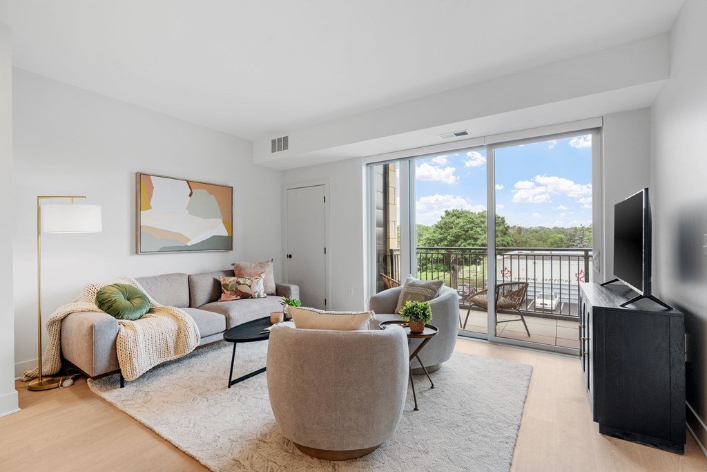 Living room in a one-bedroom, one-bathroom apartment home at Lilia in Lilydale, MN 55118