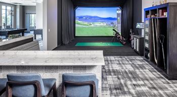 a living room with a bar and a view of a golf course at Expo, Minneapolis
