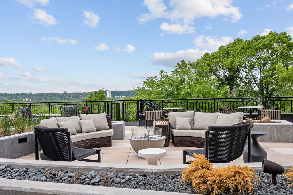 Zen Terrace with Lounge Chairs and Grills at Lilia Apartments in Lilydale, MN 55118