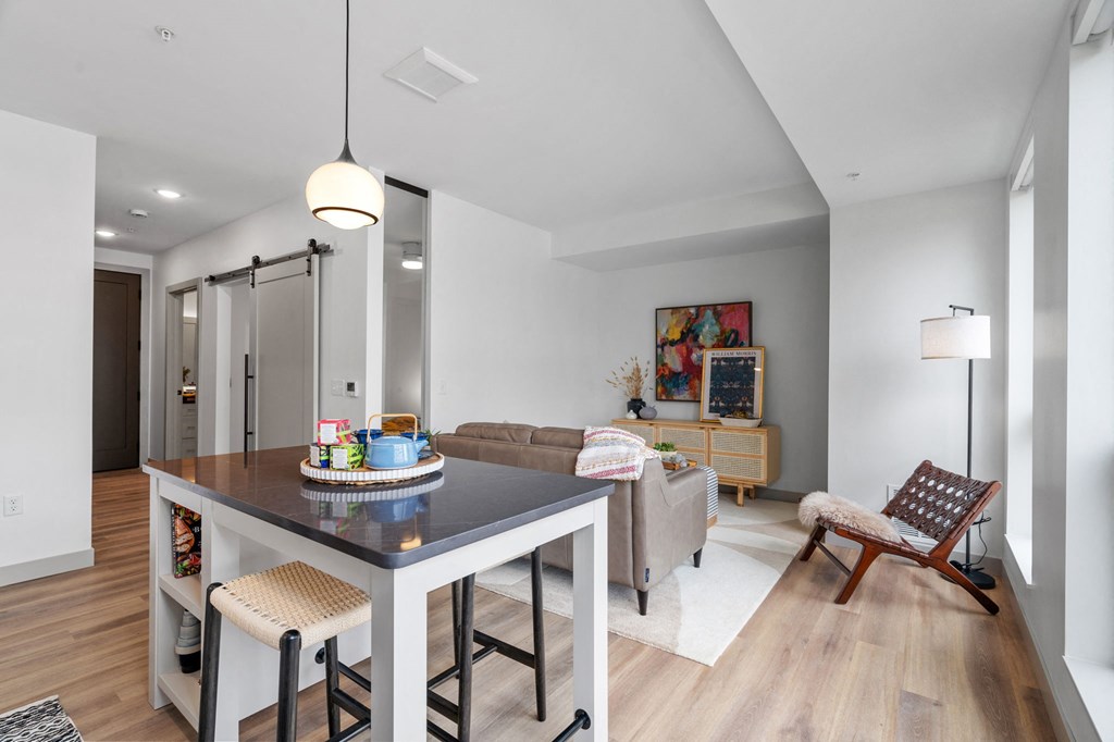 a living area with a dining table and a couch at The Mera, Minnesota