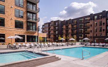 a swimming pool in front of an apartment building at Expo, Minneapolis