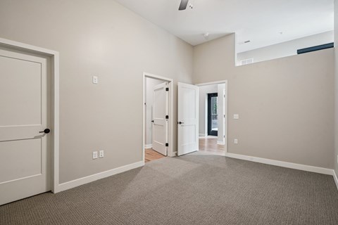 A room with carpeted floor and white walls.