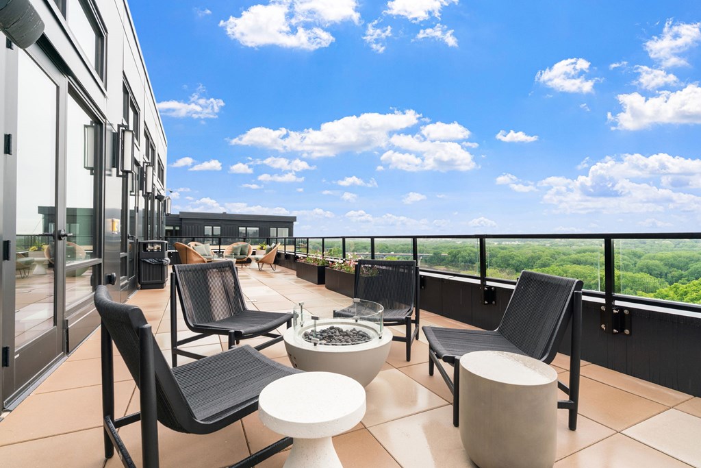 Top floor terrace with seating and fire pits leading from the Parlour and the Tea Room at Lilia in Lilydale, 55118