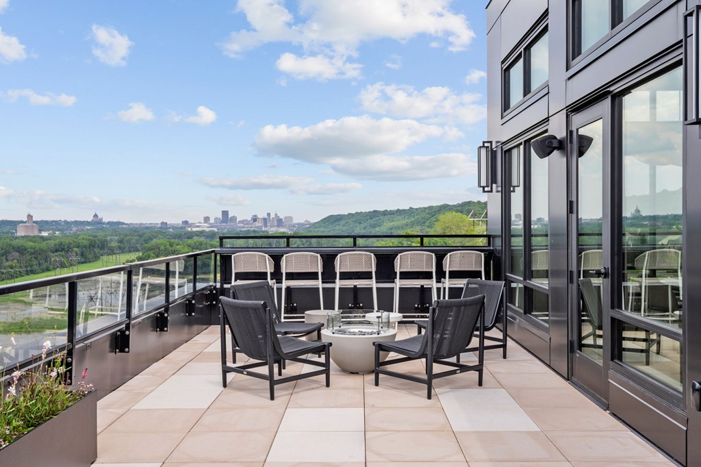 Top Floor Terrace attached to The Parlour and the Tea Room with fire pits and chairs at Lilia Apartments in Lilydale, MN 55118