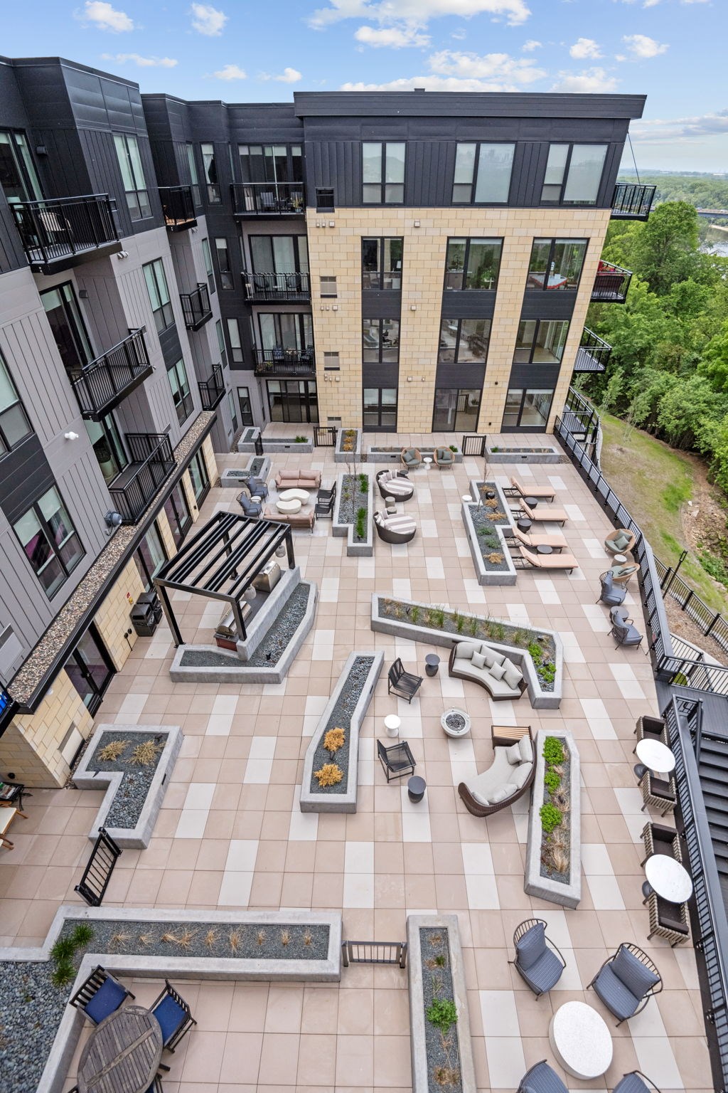 Zen Terrace with Lounge Chairs and Grills at Lilia Apartments in Lilydale, MN 55118