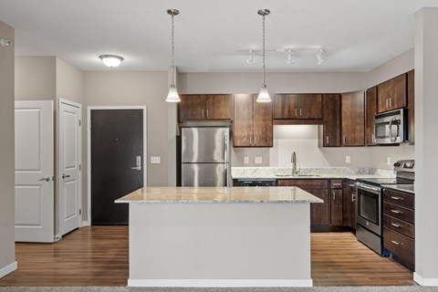 A modern kitchen with a large island in the center.
