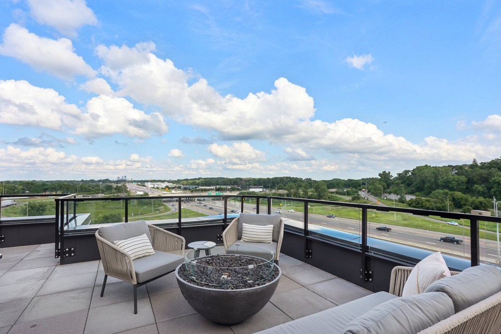 The top-floor terrace with grills and fire pits at The Mera in St. Louis Park, 55426
