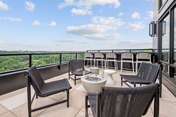 Top floor terrace attached to The Parlour and The Tea Room with fire pits and lounge chairs at Lilia Apartments in Lilydale, MN 55118