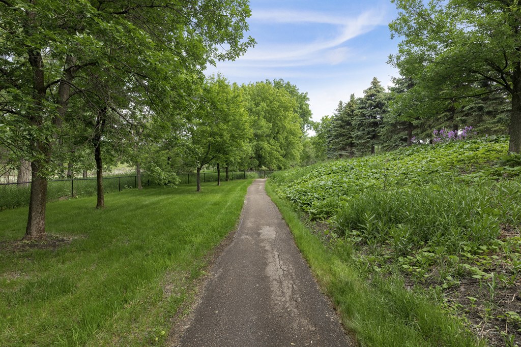 a path in a park with green grass and trees  at Shadow Hills, Minnesota, 55442