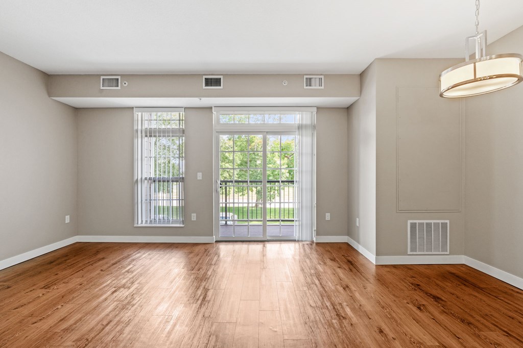 Living and dining rooms of the Modern Collection at Evans Meadows Apartments in Elk River, MN 55330