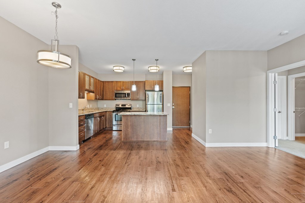 Kitchen, living and dining rooms of the Modern Collection at Evans Meadows Apartments in Elk River, MN 55330