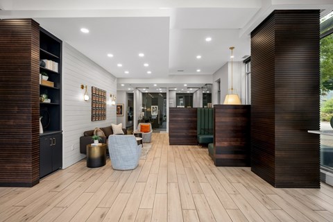 A modern interior with wood floors and furniture.