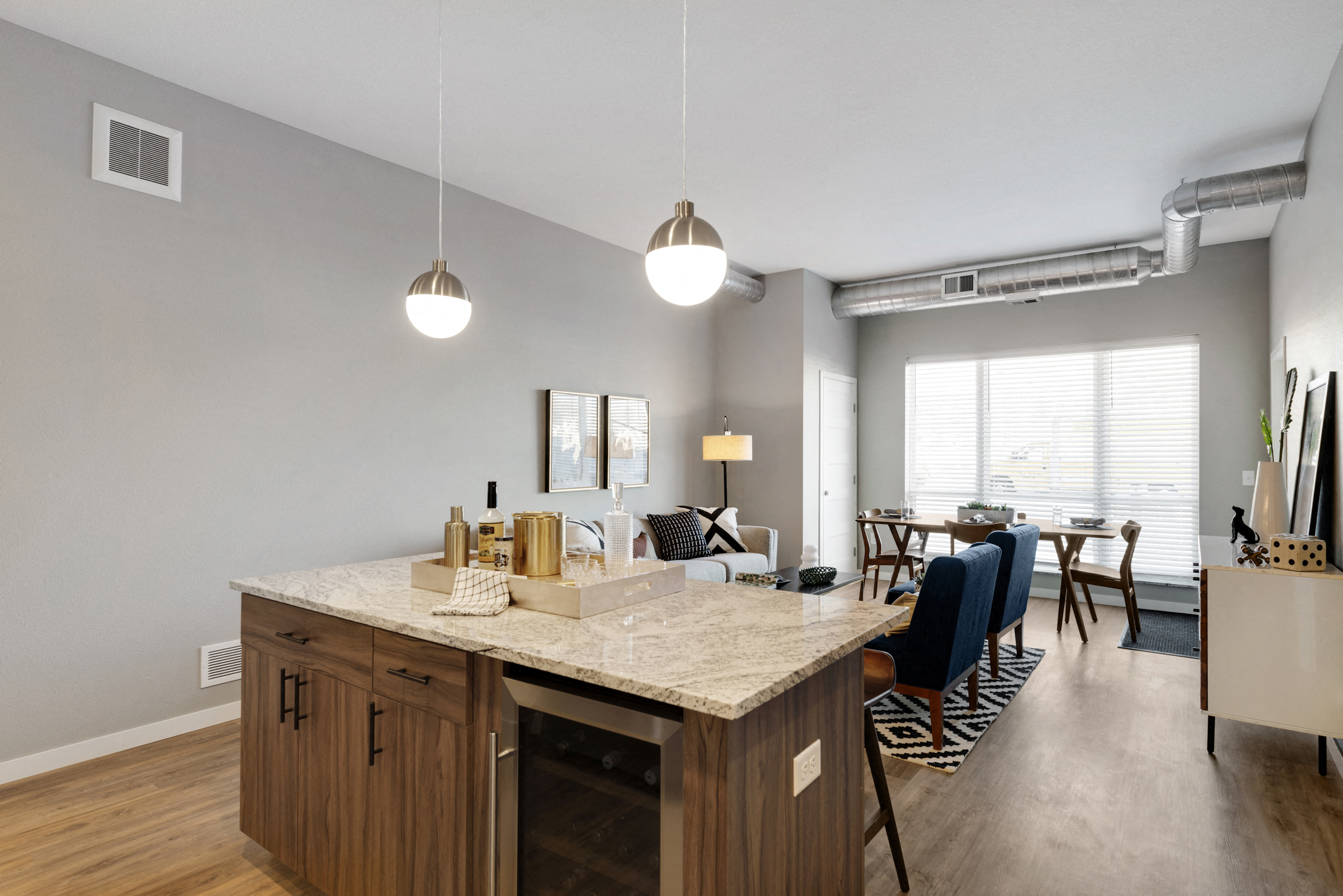 Kitchen island and bright windows at Nuvelo at Parkside in Apple Valley, MN