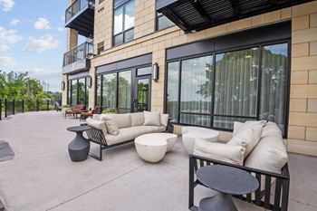 The outdoor Game Terrace outside of the Game Lounge at Lilia Apartments in Lilydale, MN 55118