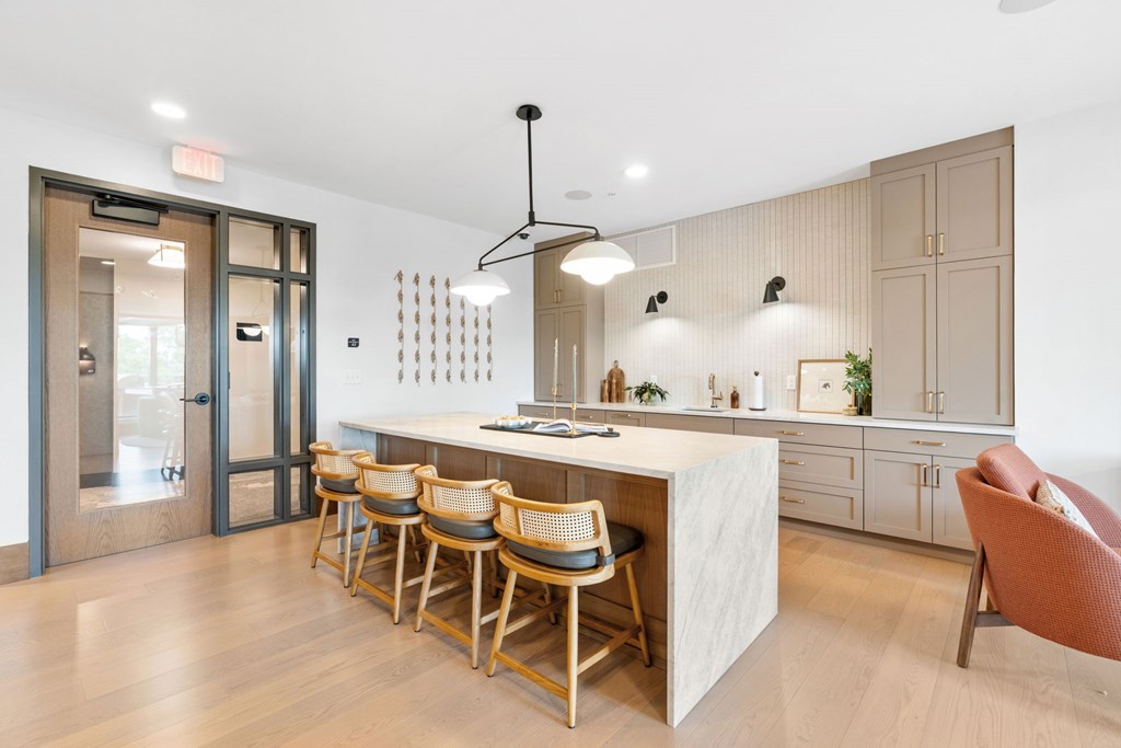 The kitchen in the Clubroom, a reservable community room at Lilia in Lilydale, MN 55118
